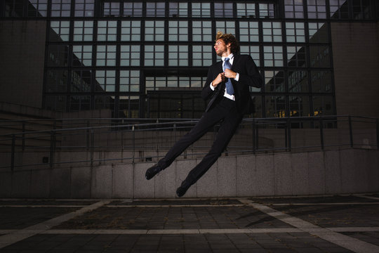 Young businessman floating in the air