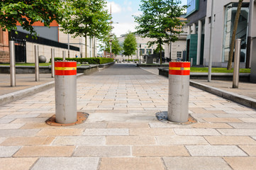 Fototapeta na wymiar Two rising bollards at the Laganside Courts, Belfast