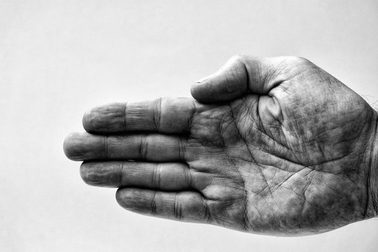 Grainy black and white of a middle aged male hand