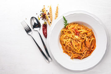 Ala Alio Pasta. On a wooden background. Top view. Free space for text.