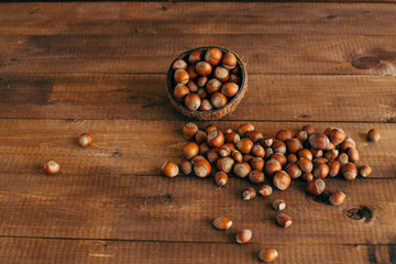 Autumn harvest. Nuts on a wooden background.