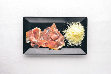 Chopped meat and parmesan. On a wooden background. Top view. Free space for text.