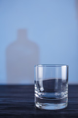 Empty whiskey glass on the table. Alcohol drinks, bar concept