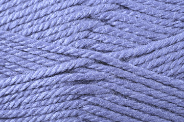 A super close up image of violet yarn
