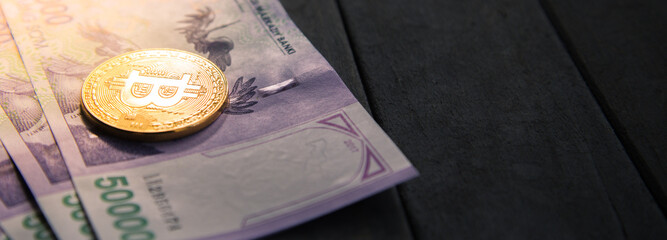 Uzbek banknotes and Bitcoin. Fifty Thousand Uzbek Sums