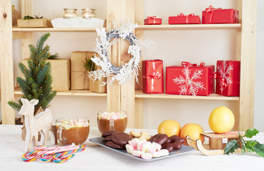 Christmas sweets on white wooden table
