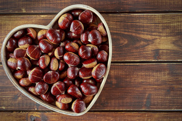 Chestnuts on wooden table