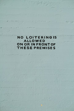 hand painted no loitering sign