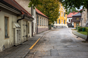 Narrow street with old buildings in Cesis town, Latvia