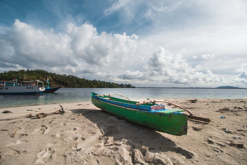 Traditional Wooden Canoe at Beautiful Tropical Beach 