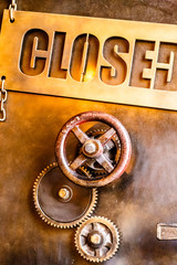 Different gears and a steering wheel with a sign 