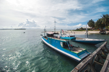 Naklejka na ściany i meble Traditional Fishing Boat and Beautiful Tropical Beach 