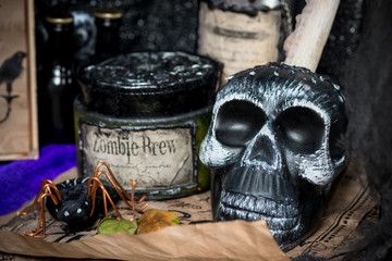 black skull on the witch's desk close-up
