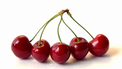 Close up Five Ripe Red Cherries Isolated White Background