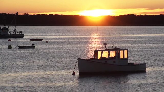 Maine, scenic sunset over boats in Prospect Harbor