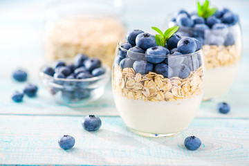 Yogurt with granola  and  blueberry  for healthy morning meal, selective focus