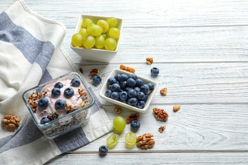 Dessert with quinoa and blueberries on wooden table