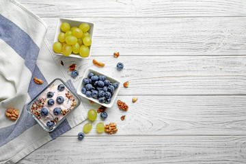 Dessert with quinoa and blueberries on wooden table