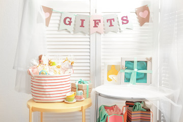 Gifts for baby shower party on tables indoors