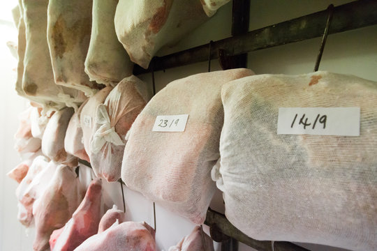 Joints of maturing meat in muslin wrappings
