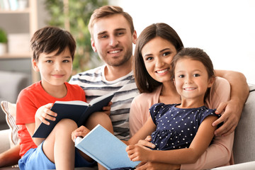 Happy family reading books at home