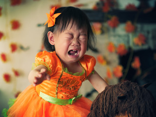 Baby girl crying on her first halloween party