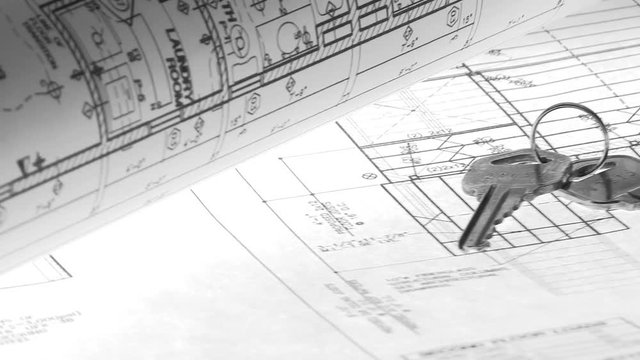 Blueprints and Keys Rotation Construction Real Estate Concept