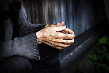Hands are very elderly. Wrinkled hands of old men. The concept o