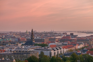 Copenhagen skyline with industrial harbor area at sunrise