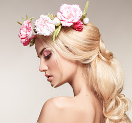 Beautiful woman portrait with long blonde hair and flowers on head. Tender bride.  - 175284592