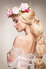 Beautiful woman portrait with long blonde hair and flowers on head. Tender bride.  - 175284739