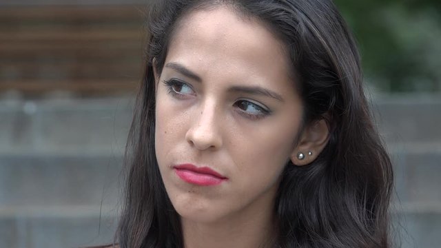 Sad Depressed Young Hispanic Woman