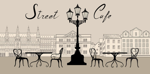 Retro cityscape with building facade. Street cafe - table, chair