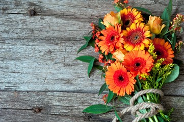 orange flowers on a wooden background