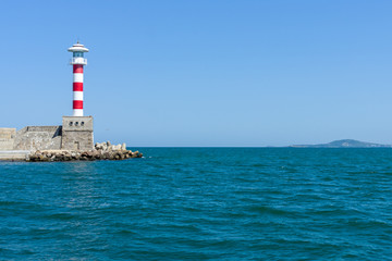 Lighthouse at the entrance to the water area of the sea port of Burgas. Bulgaria.