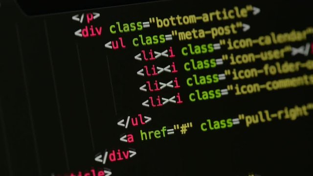 HTML and CSS code developing. Website design code programming on a laptop screen