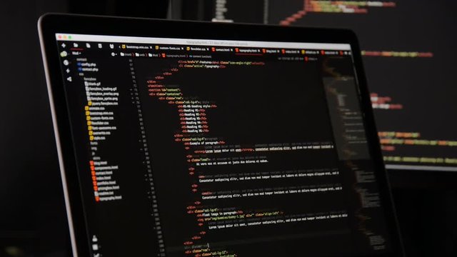 HTML and CSS code developing. Website design code programming on a laptop screen