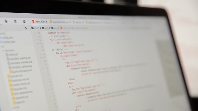 HTML and CSS code developing. Website design code programming on a laptop screen
