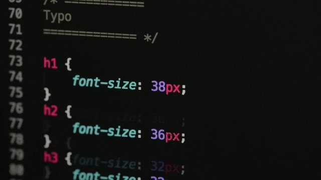 HTML and CSS code developing. Website design code programming on a laptop screen