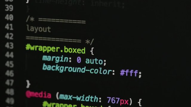 HTML and CSS code developing. Website design code programming on a laptop screen