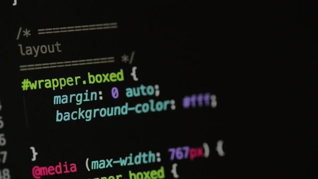 HTML and CSS code developing. Website design code programming on a laptop screen