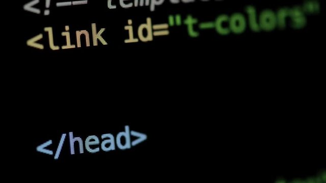 HTML and CSS code developing. Website design code programming on a laptop screen