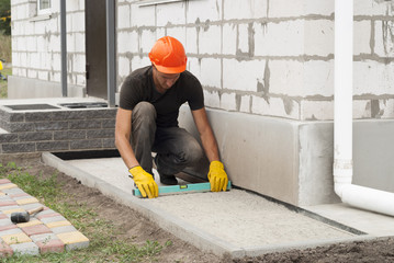laying of paving slabs
