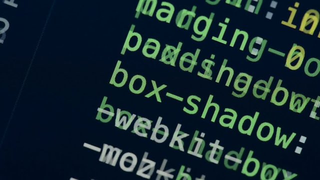 HTML and CSS code developing. Website design code programming on a laptop screen
