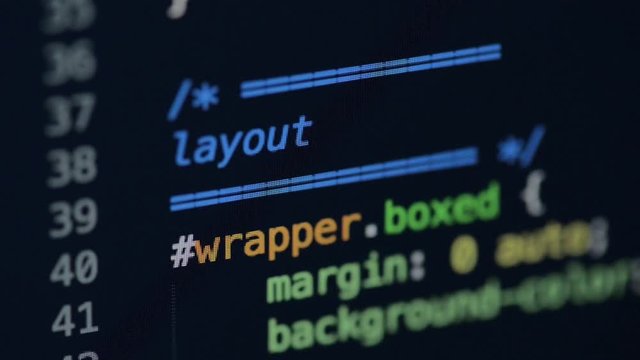 HTML and CSS code developing. Website design code programming on a laptop screen