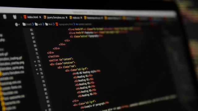 HTML and CSS code developing. Website design code programming on a laptop screen