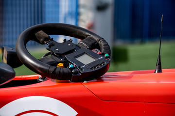 Single seater formula racing car steering wheel detail