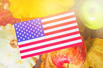 Thanksgiving in the States. Autumn harvest. Pumpkins, apples in the USA. American flag.