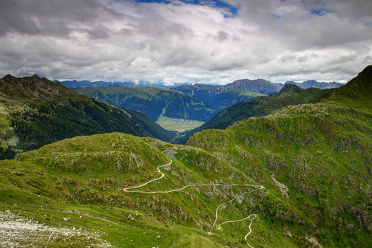 Tilliacher Joch / Forcella Dignas pass over Carnic Alps main ridge from Italy to Austria with Obertilliach village, Lesachtal valley, Golzentipp ski resort, Eggenkofel peak, Gailtal Alps in background