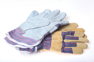 Two Pair of protective work gloves isolated on a white background.